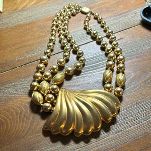 Chunky vintage gold toned necklace with shape of seashell and beads